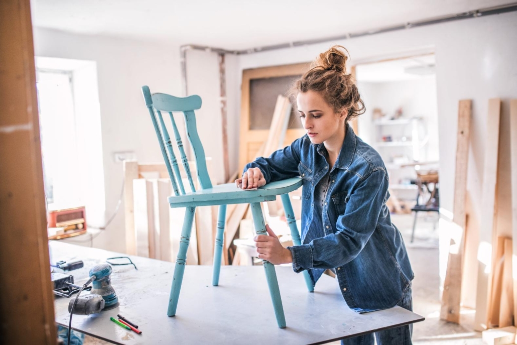 Woman starting a new business for furniture refinishing
