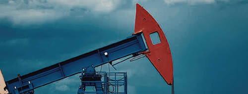 Oil pump against a dark sky